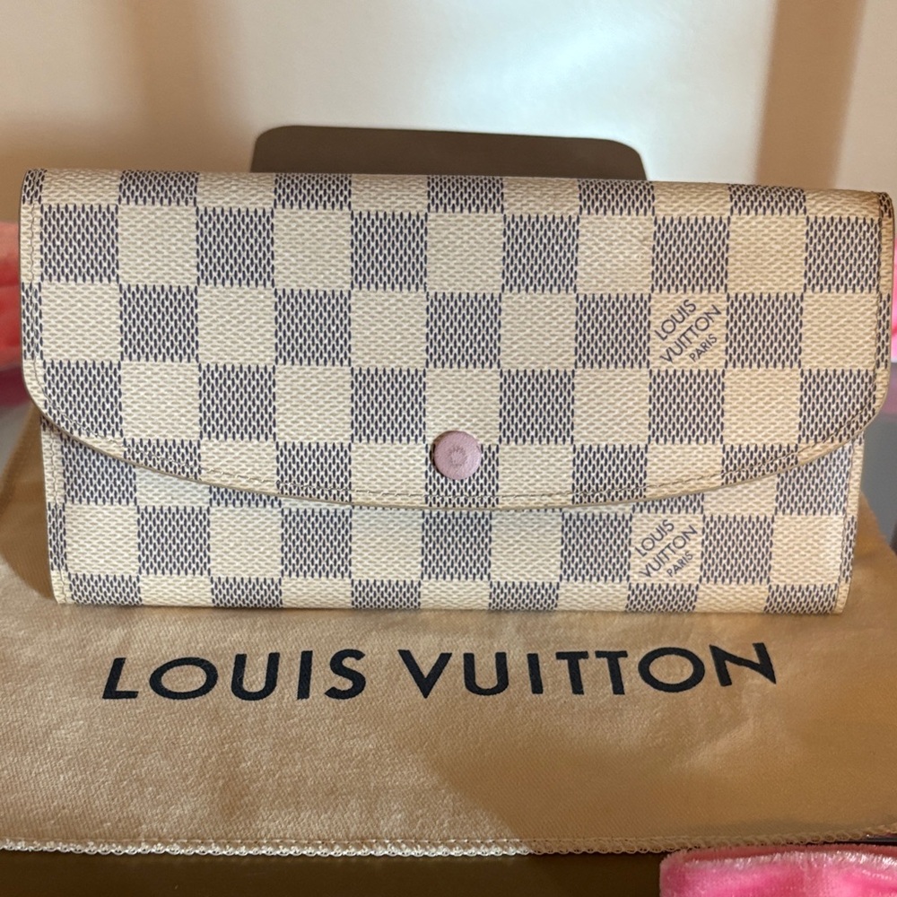 Louis Vuitton Cream Checkered Women's Emilie Wallet with pink interior.
